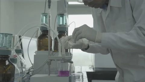 In a Modern Laboratory Scientist Conducts Experiments Stock Footage 152948456