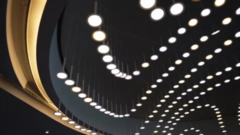 Modern lamp ceiling installation inside the Paris Saint Germain Parc des Stock Footage 280749800