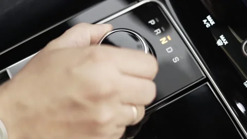 Modern land rover gear shift lever velar, man making automotive gear Stock Footage 165328304