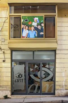 Modern Language School Building Front with Window Sign and Students Banner... Fotos de archivo