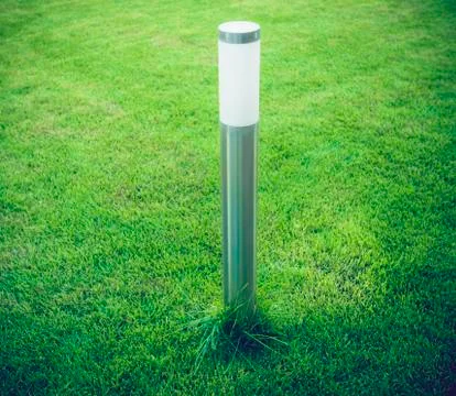 Modern Lantern on the lawn Stock Photos