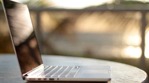 Modern laptop on the beach, shallow depth of field Stock Footage 49525608