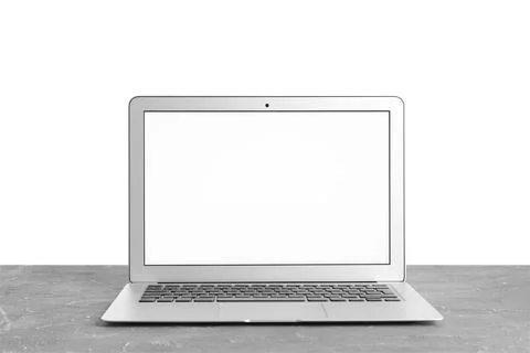 Modern laptop with blank screen on table against white background Stock Photos