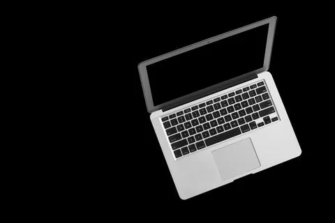 A modern laptop computer on black background 写真素材