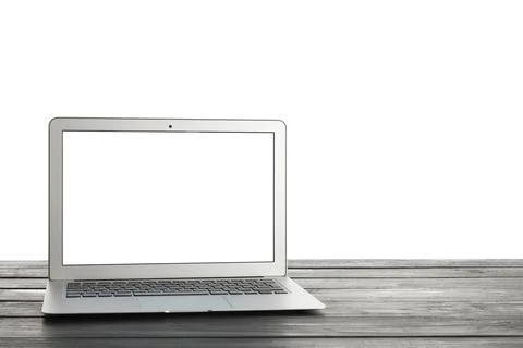 Modern laptop computer with blank white screen on rustic wooden table, digita Stock Photos