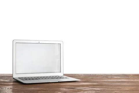 Modern laptop computer with blank white screen on rustic wooden table digital Stock Photos