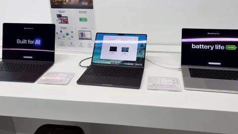 Modern Laptop Display Counter In apple Store With Premium Notebook Computers Stock Footage 339480936