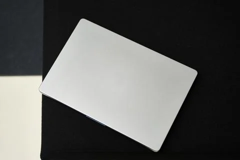 Modern Laptop on Reflective Surface Stock Photos