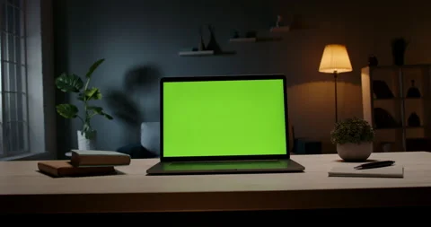 Modern laptop with template copy space green screen set on table in living room Stock-Footage 133127634