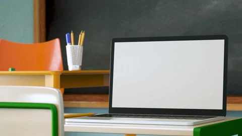 Modern laptop with white blank screen placed on desk against classroom at sch Stock Footage 204152626