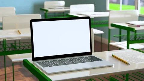 Modern laptop with white blank screen placed on desk against classroom at sch Stock Footage 209617448