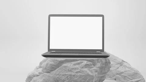 Modern laptop with a white screen sits on a white pedestal on white background Stock Footage 332895547