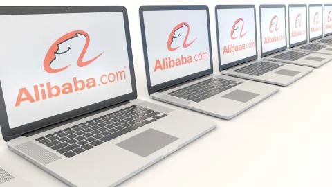Modern laptops with Alibaba.com logo. Computer technology conceptual editorial Illustrazione stock