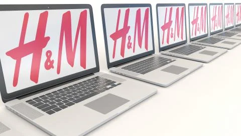 Modern laptops with H M logo. Computer technology conceptual editorial 3D Illustrazione stock
