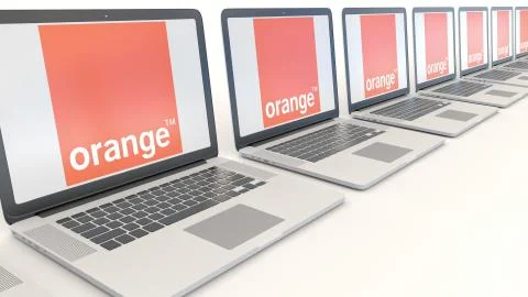 Modern laptops with Orange S.A. logo. Computer technology conceptual editorial Stock-Illustration