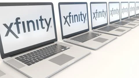 Modern laptops with Xfinity logo. Computer technology conceptual editorial 3D 스톡 일러스트