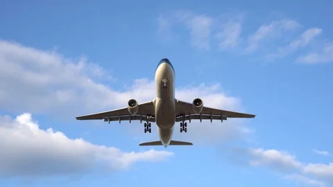 Modern large plane flies in the blue sky. White clouds in the background. 4K Stock Footage 117376756