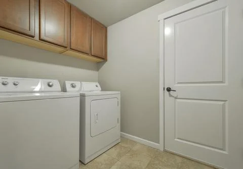 Modern laundry room interior Stock Photos