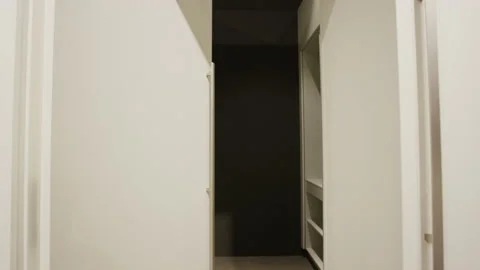 Modern laundry room with white cabinets and integrated washing machine Stockbeeldmateriaal 155208532