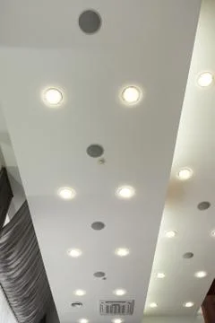 Modern layered ceiling with embedded lights and red cloth Stock Photos