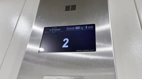 Modern LCD display in elevator showing change of floors when going up with Stock Footage 339244411
