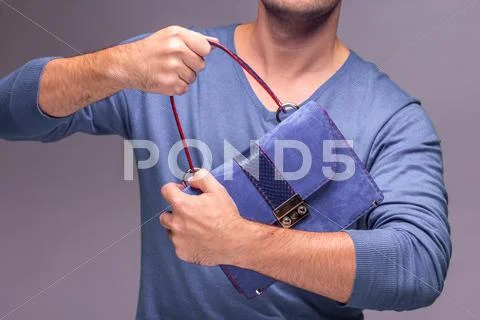 Modern leather bag in hands Stock Photos