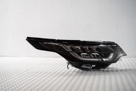 Modern LED car headlight isolated on white background Stock Photos