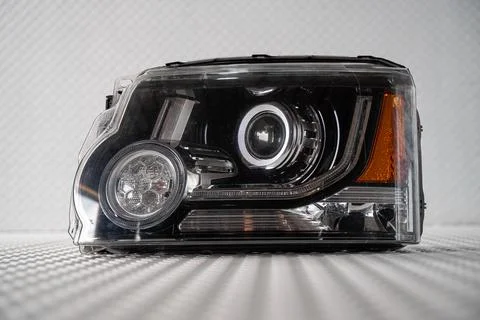Modern LED car headlight isolated on white background Фото