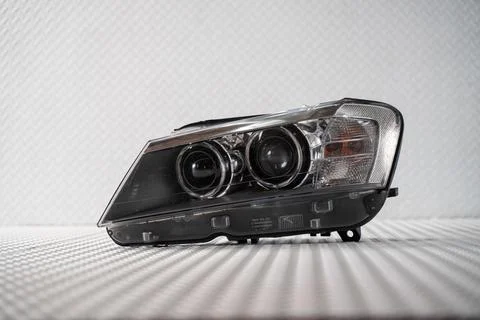 Modern LED car headlight isolated on white background Stock Photos