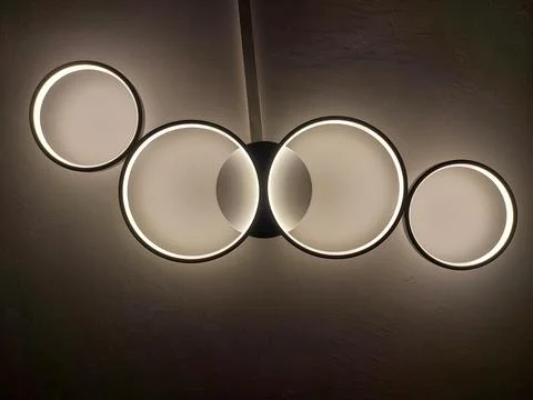 Modern LED Ceiling Light Fixture with Interlocking White and Black Rings Stock Photos