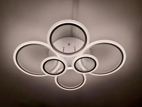 Modern LED Ceiling Light Fixture with Interlocking White and Black Rings Stock Photos