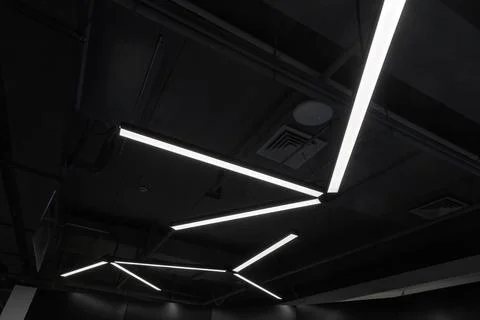 Modern LED ceiling lights form angular geometric patterns Stock Photos