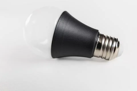 Modern LED light bulb with black body isolated on white background Stock Photos