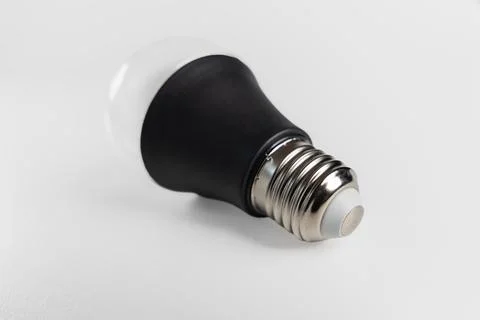 Modern LED light bulb with black body isolated on white background Stock Photos