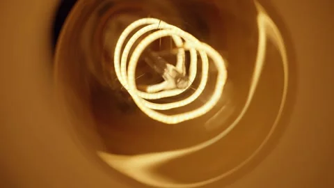 Modern led light bulb shining warm light, energy saving illumination Stock Footage 312207926