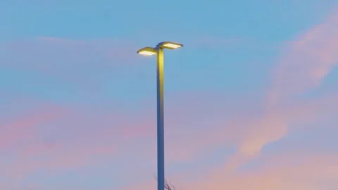 Modern LED streetlight with large sunset negative space Stock-Footage 331983213