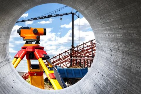 Modern level for geodesy at a construction site. Surveyors ensure precise mea Photos