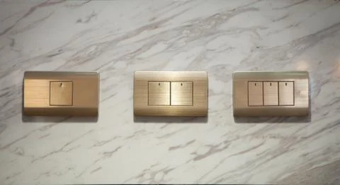 Modern light electrical switch with modern marble background. Stock Photos