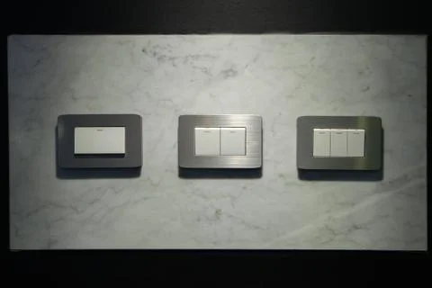 Modern light electrical switch with modern marble background. Foto stock