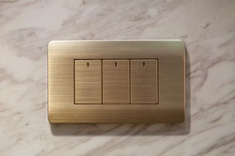 Modern light electrical switch with modern marble background. Foto stock