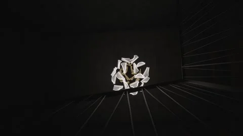 Modern light fixture hanging in a dark, minimalist interior, casting dramatic Stock Footage 334869236