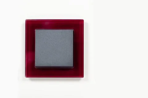 Modern light switch on the wall close up Stock Photos