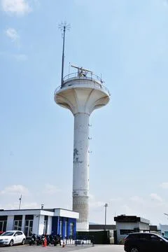 A modern lighthouse on the shore. Stock Photos