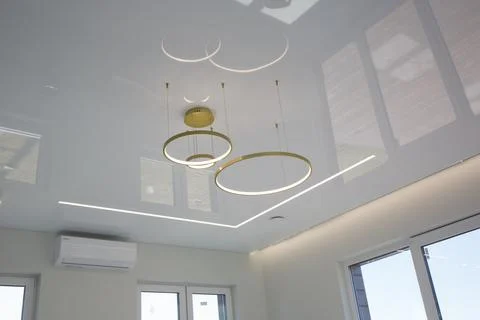 Modern lighting in the interior with a stretch ceiling Stock Photos