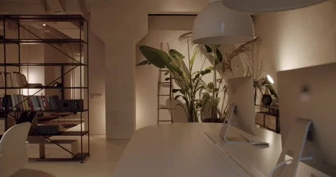 Modern loft office interior with computers and plants Stock Footage 345543511