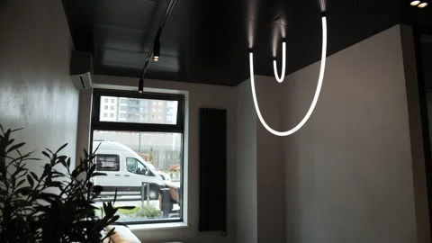 Modern lounge with window, sofa and LED ceiling light Stock Footage 311278006