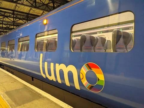Modern Lumo train with Progress Pride Flag logo waiting at London Kings Cross Foto stock