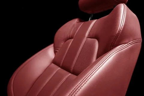 Modern luxury car red leather interior. Part of red perforated leather car .. Stock-Fotos