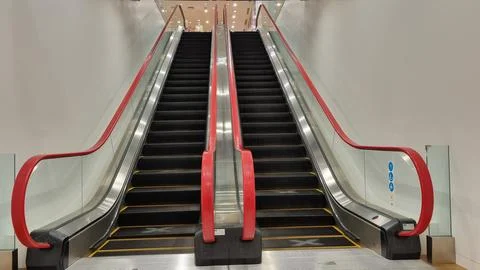 Modern luxury escalators with staircase. Stock Photos