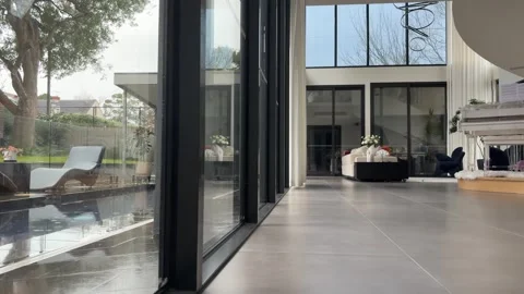 Modern Luxury Home Interior with Pool View on Rainy Day Stock Footage 342730510